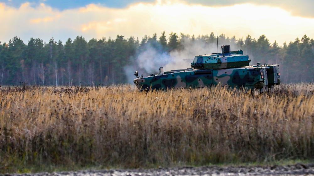 The Borsuk (Badger) Infantry Fighting Vehicle (IFV) fires its 30mm cannon during a weapons demonstration during the unveiling ceremony in front of attendees